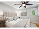 Well-lit primary bedroom with a ceiling fan and soothing decor at 2683 Bellaire St, Denver, CO 80207