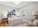 Bedroom features hardwood floors, natural light and neutral colors at 2683 Bellaire St, Denver, CO 80207