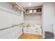 Spacious walk-in closet with built-in storage and organization system at 2683 Bellaire St, Denver, CO 80207