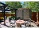 Outdoor patio with brick fire pit and seating, perfect for social gatherings at 2683 Bellaire St, Denver, CO 80207