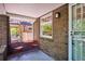 Inviting front porch with charming table and chairs, perfect for enjoying the outdoors at 2683 Bellaire St, Denver, CO 80207