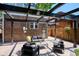 Outdoor patio featuring comfortable seating under a stylish pergola, ideal for relaxation at 2683 Bellaire St, Denver, CO 80207