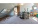 Bright and airy attic space with a spiral staircase, cozy design, and natural light at 3147 Umatilla St, Denver, CO 80211