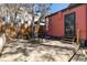 Wooden deck with an outdoor dining table and chairs, along with a white patio umbrella at 3147 Umatilla St, Denver, CO 80211