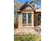 Charming two-story home with stone and brick exterior details, including a stone bay window at 3147 Umatilla St, Denver, CO 80211