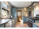 Modern kitchen features stainless steel appliances, granite countertops, and stylish cabinetry at 3147 Umatilla St, Denver, CO 80211