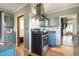 Updated kitchen featuring stainless steel appliances and ample counter space, plus a spiral staircase at 3147 Umatilla St, Denver, CO 80211