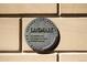 Close-up of a Landmark plaque on the building's exterior, signifying historical preservation at 3147 Umatilla St, Denver, CO 80211