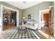 Living room featuring wood floors, a spiral staircase, and soft, natural light at 3147 Umatilla St, Denver, CO 80211