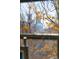 Urban view of cityscape as seen through an old window with winter vegetation at 3147 Umatilla St, Denver, CO 80211