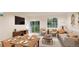 Cozy living room with comfortable seating, a modern TV, and a sliding glass door leading to the outdoor space at 22341 E 38Th Pl, Aurora, CO 80019
