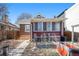 Red brick home with a small garden and covered patio in the backyard at 2921 N Fillmore St, Denver, CO 80205