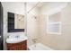 Classic bathroom with vanity sink, bath tub, tile surround and natural light at 2921 N Fillmore St, Denver, CO 80205