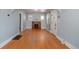 Light-filled living room with hardwood floors, fireplace, and built-in bookshelves at 2921 N Fillmore St, Denver, CO 80205