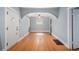 Bright living room features hardwood floors, arched entryway and natural light at 2921 N Fillmore St, Denver, CO 80205