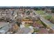 Ariel view of the house showcasing its location in a quiet neighborhood with mature trees at 11542 W 67Th Way, Arvada, CO 80004