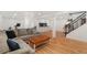 Relaxing basement with hardwood floors, comfortable sofa and entertainment area at 11542 W 67Th Way, Arvada, CO 80004