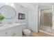 Bright bathroom features stylish vanity, tile flooring and a glass enclosed shower at 11542 W 67Th Way, Arvada, CO 80004