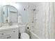 Clean bathroom with white vanity, shower-tub combo, and soft blue walls at 11542 W 67Th Way, Arvada, CO 80004