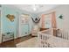 Bedroom featuring hardwood floors, white trim and a cozy hammock at 11542 W 67Th Way, Arvada, CO 80004