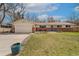 Charming single-story home with a well-manicured lawn and an attached two-car garage at 11542 W 67Th Way, Arvada, CO 80004