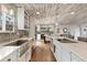 Modern kitchen boasts stainless steel appliances, white cabinets, and stylish countertops at 11542 W 67Th Way, Arvada, CO 80004