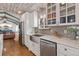 A partial view of the kitchen that features white cabinets and stainless steel appliances at 11542 W 67Th Way, Arvada, CO 80004