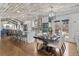 Bright open-concept space featuring a modern kitchen, island, dining area and hardwood floors at 11542 W 67Th Way, Arvada, CO 80004