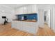 Finished basement features bar area with wet bar and exercise equipment at 11542 W 67Th Way, Arvada, CO 80004