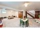 Spacious basement featuring carpet flooring, painted walls, and stairs leading to the floor above at 5157 S Sedalia Ct, Centennial, CO 80015