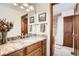 Bathroom featuring granite countertop vanity with mirror and wood cabinet at 5157 S Sedalia Ct, Centennial, CO 80015