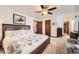 Bedroom with a decorative comforter, ceiling fan, and closet at 5157 S Sedalia Ct, Centennial, CO 80015
