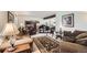 Comfortable living room featuring a grand piano, plush seating, and a stylish decorative rug at 5157 S Sedalia Ct, Centennial, CO 80015