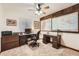 Inviting home office with wood accents, neutral carpet, and world maps to inspire productivity at 5157 S Sedalia Ct, Centennial, CO 80015