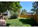 Beautiful lawn and wood fence are highlights of this home's backyard at 7804 Silverweed Way, Lone Tree, CO 80124