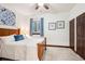 Bright bedroom featuring a wood bed frame and comfortable linens at 7804 Silverweed Way, Lone Tree, CO 80124