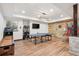 Spacious game room with a ping pong table, shuffleboard, and unique wall decor at 7804 Silverweed Way, Lone Tree, CO 80124