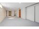 Unfinished basement featuring neutral carpet and painted walls at 1121 S Ogden St, Denver, CO 80210