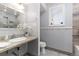 Bathroom featuring granite countertop vanity, updated faucet, and neutral color scheme at 1121 S Ogden St, Denver, CO 80210