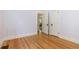 Bedroom featuring gleaming hardwood floors and spacious closet at 1121 S Ogden St, Denver, CO 80210
