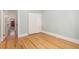 Simple bedroom featuring hardwood floors and a large closet at 1121 S Ogden St, Denver, CO 80210