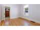 Bedroom featuring gleaming hardwood floors, large windows and neutral wall colors at 1121 S Ogden St, Denver, CO 80210