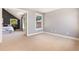 Bonus room offers neutral carpet, fresh paint, and bright natural light at 1121 S Ogden St, Denver, CO 80210