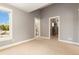 Bonus room offers neutral carpet, fresh paint, and great natural light at 1121 S Ogden St, Denver, CO 80210
