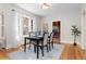 Cozy dining room featuring modern decor, wood floors and ample natural light at 1121 S Ogden St, Denver, CO 80210