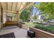 Inviting front porch with swing and built-in planters under a decorative porch roof at 1121 S Ogden St, Denver, CO 80210