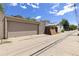 Detached two car garage with concrete driveway and alley access at 1121 S Ogden St, Denver, CO 80210