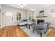 Bright living room with a decorative fireplace, hardwood floors, and large windows at 1121 S Ogden St, Denver, CO 80210