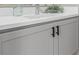 Bathroom vanity with gray cabinets, modern hardware, quartz countertops, and a stylish vessel sink at 2436 Welton St, Denver, CO 80205