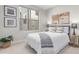 Bright bedroom featuring a large window, neutral decor, and stylish furnishings at 2436 Welton St, Denver, CO 80205